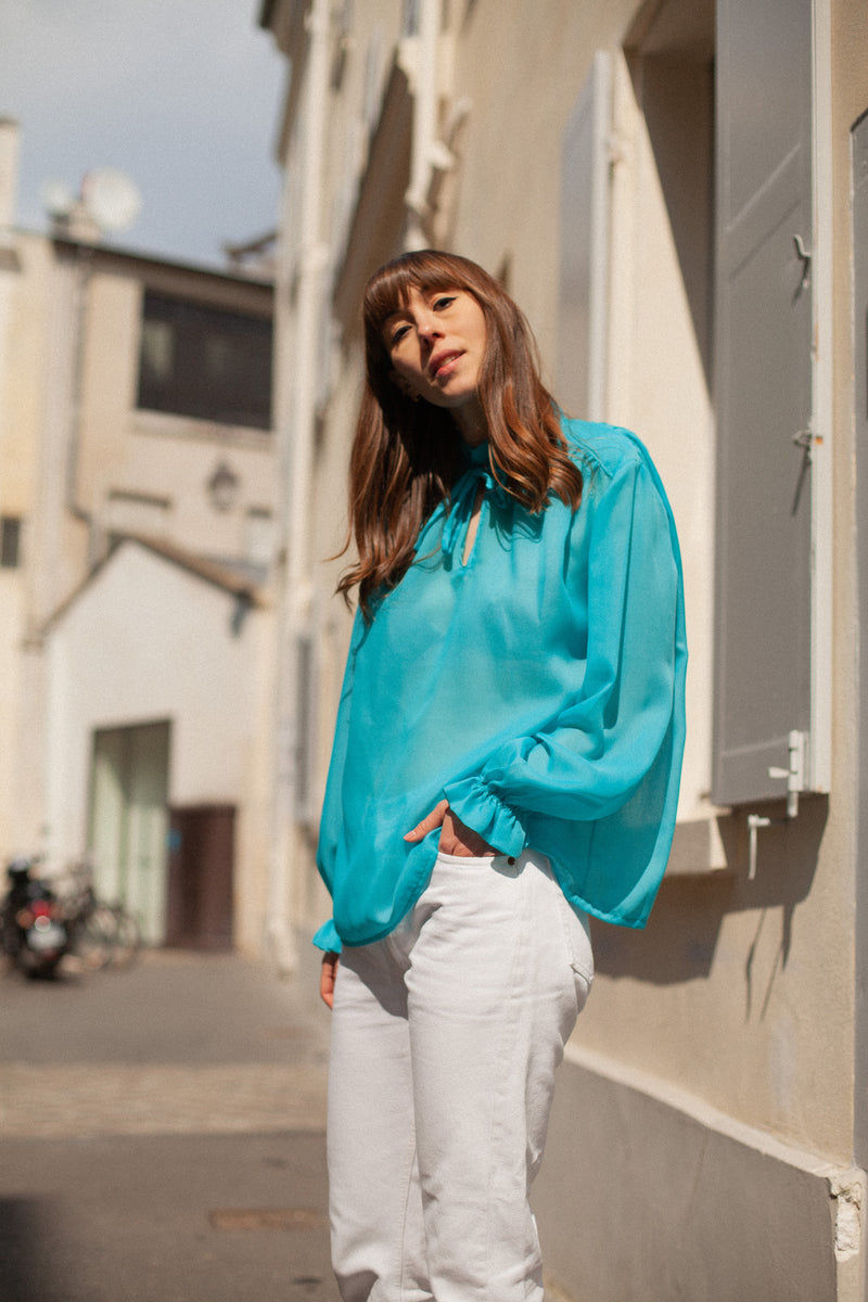 Anita is Vintage 60s Turquoise Long Sleeve Blouse with Ruffle Collar