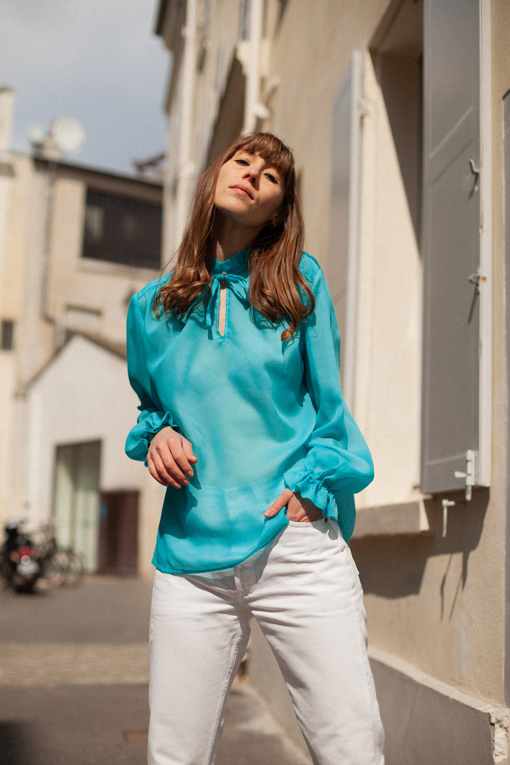 Anita is Vintage 60s Turquoise Long Sleeve Blouse with Ruffle Collar