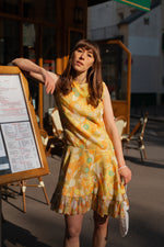 Anita is Vintage 60s Yellow & Orange Floral Ruffle Hem Sleeveless Mini Dress